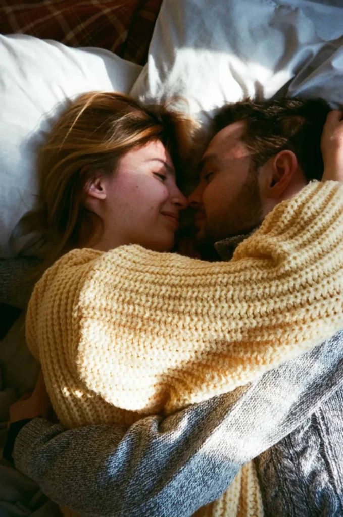 Man-Woman-Laying-Holding-Each-other