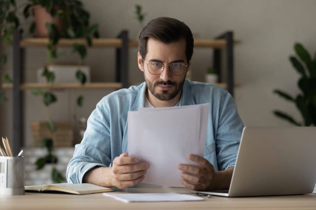 Man-reading-insurance-information
